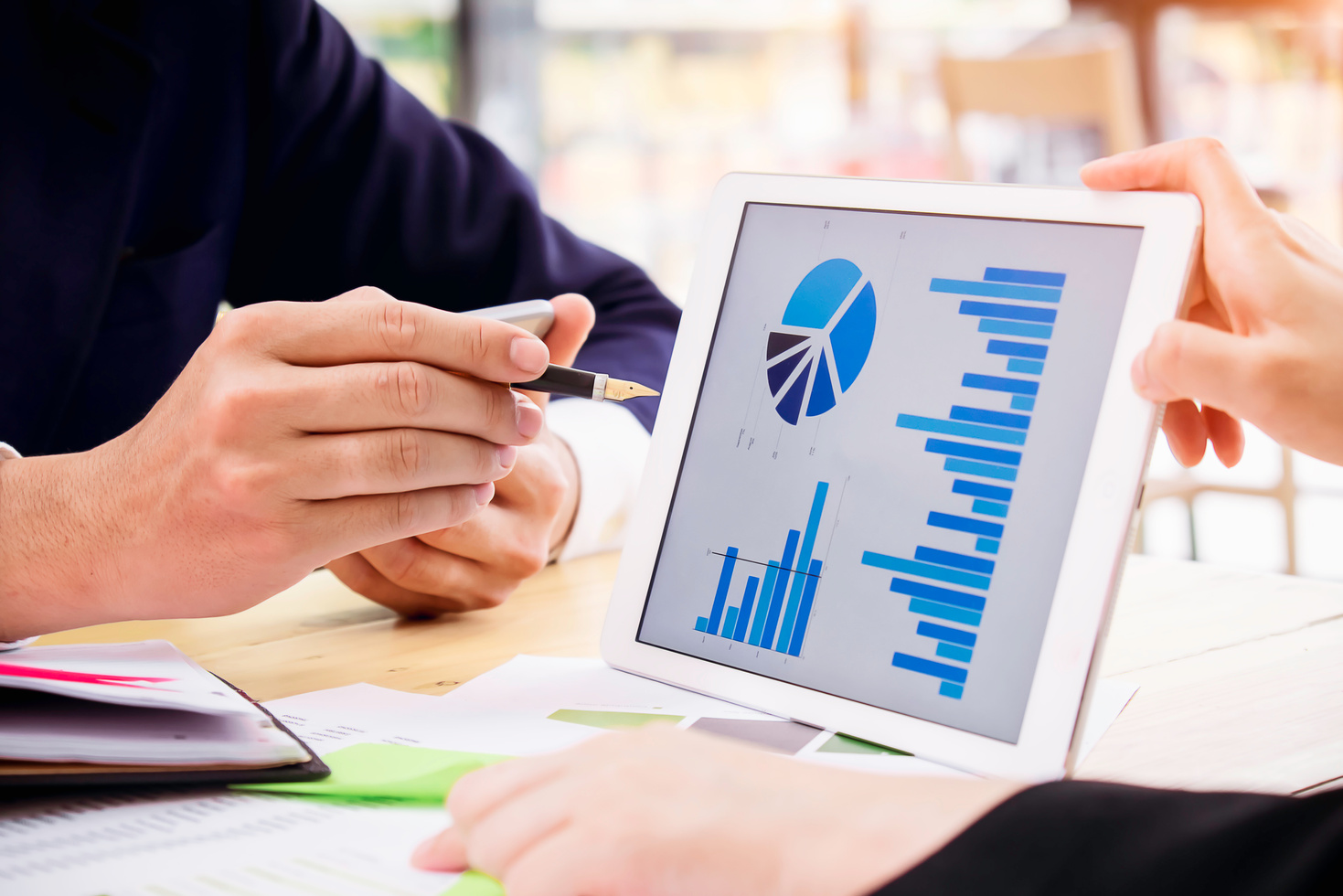 Businessmen Analyzing Business Report